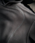 Close-up of reflective accent seam on charcoal hoodie