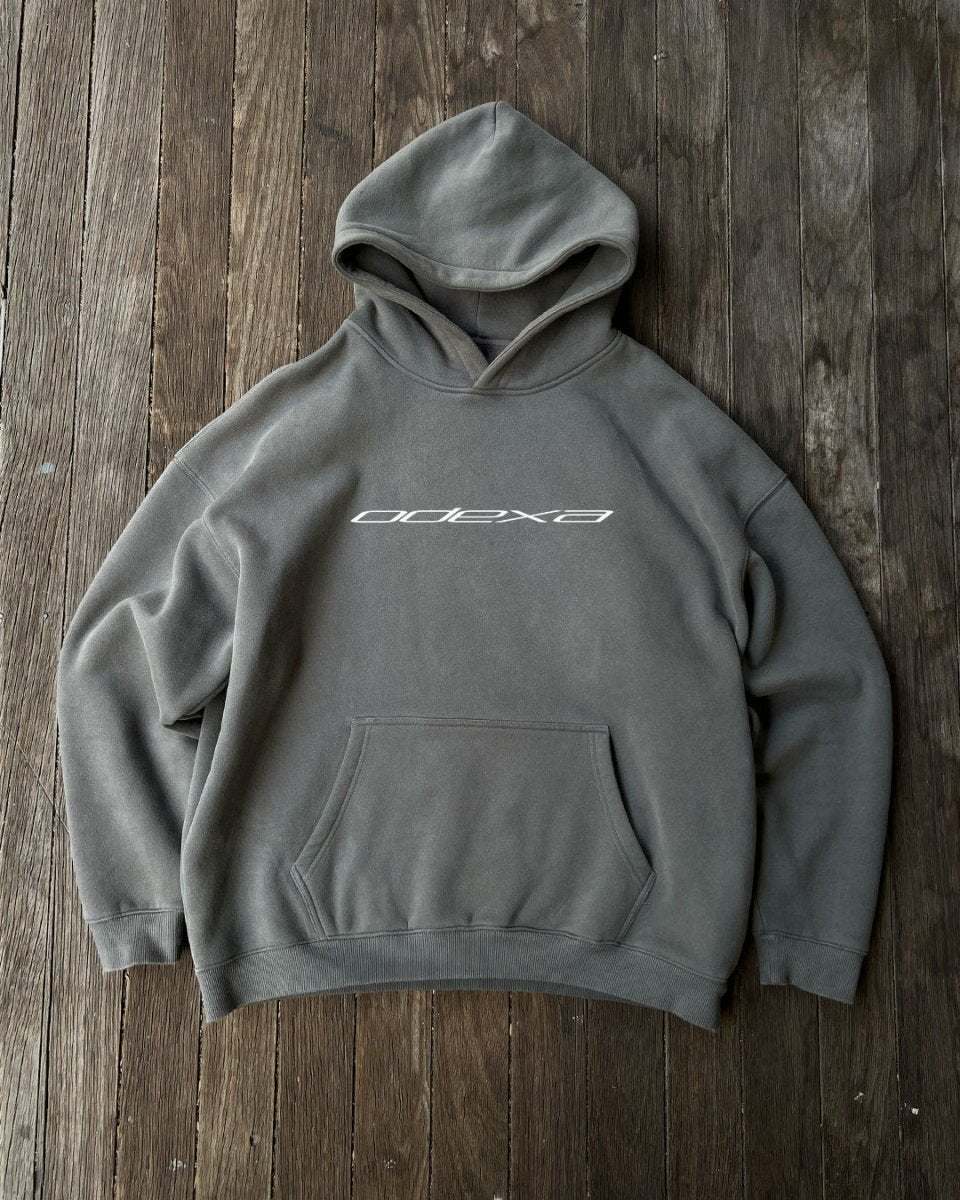 Grey oversized hoodie with white ODEXA chest logo, flat lay