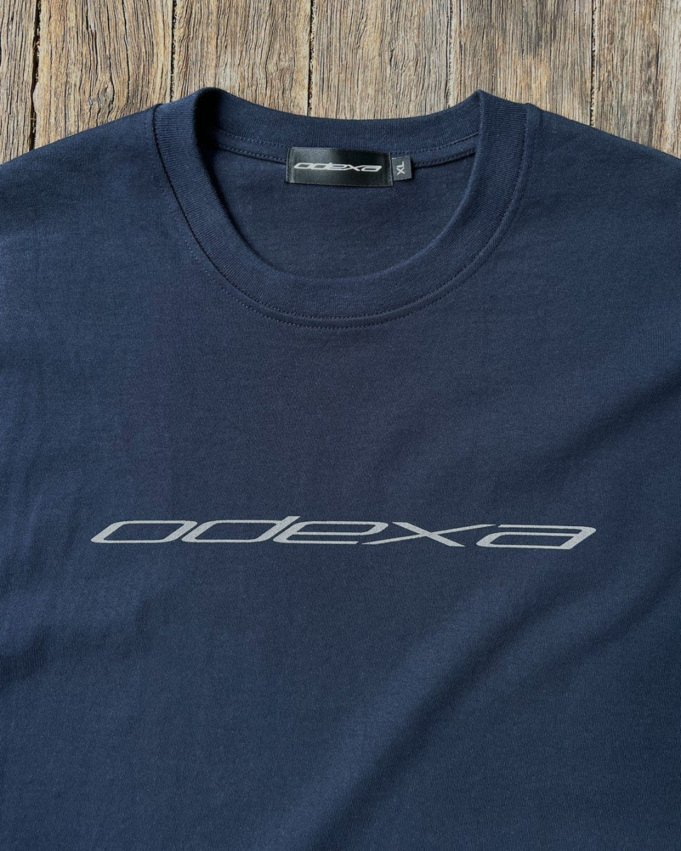 Navy heavyweight tee with white ODEXA logo print, flat lay