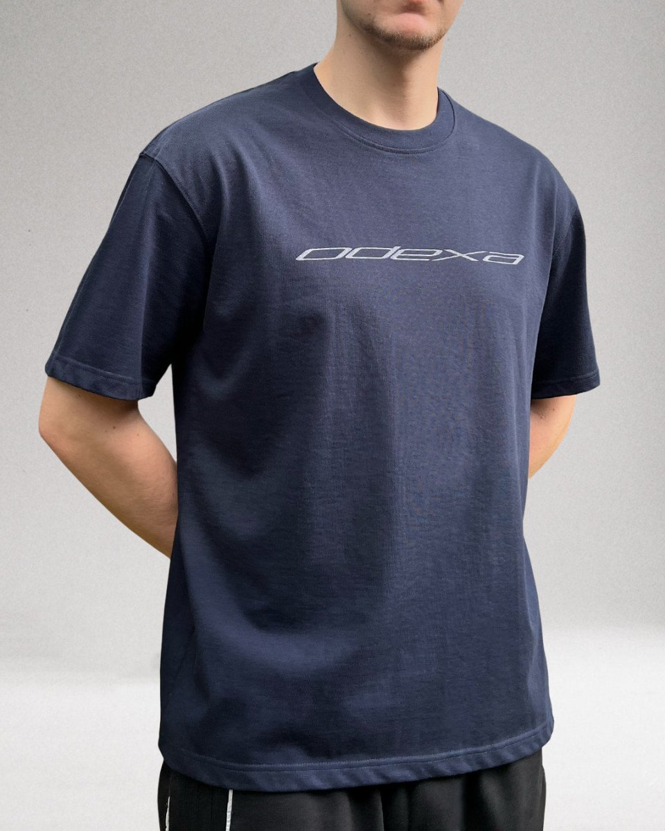 Model wearing navy ODEXA logo heavyweight tee