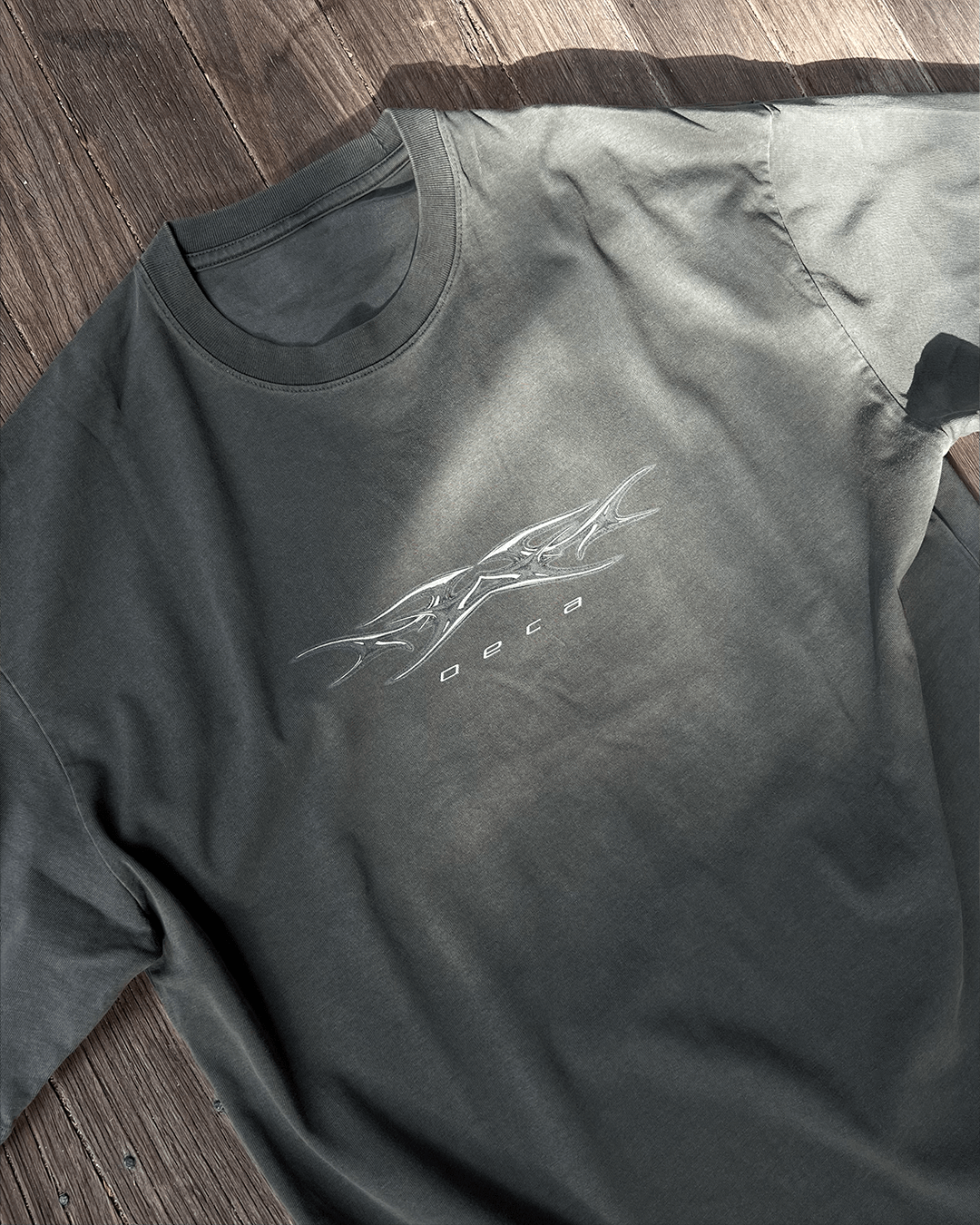 Washed grey vintage tee with tribal Sharp logo print, flat lay