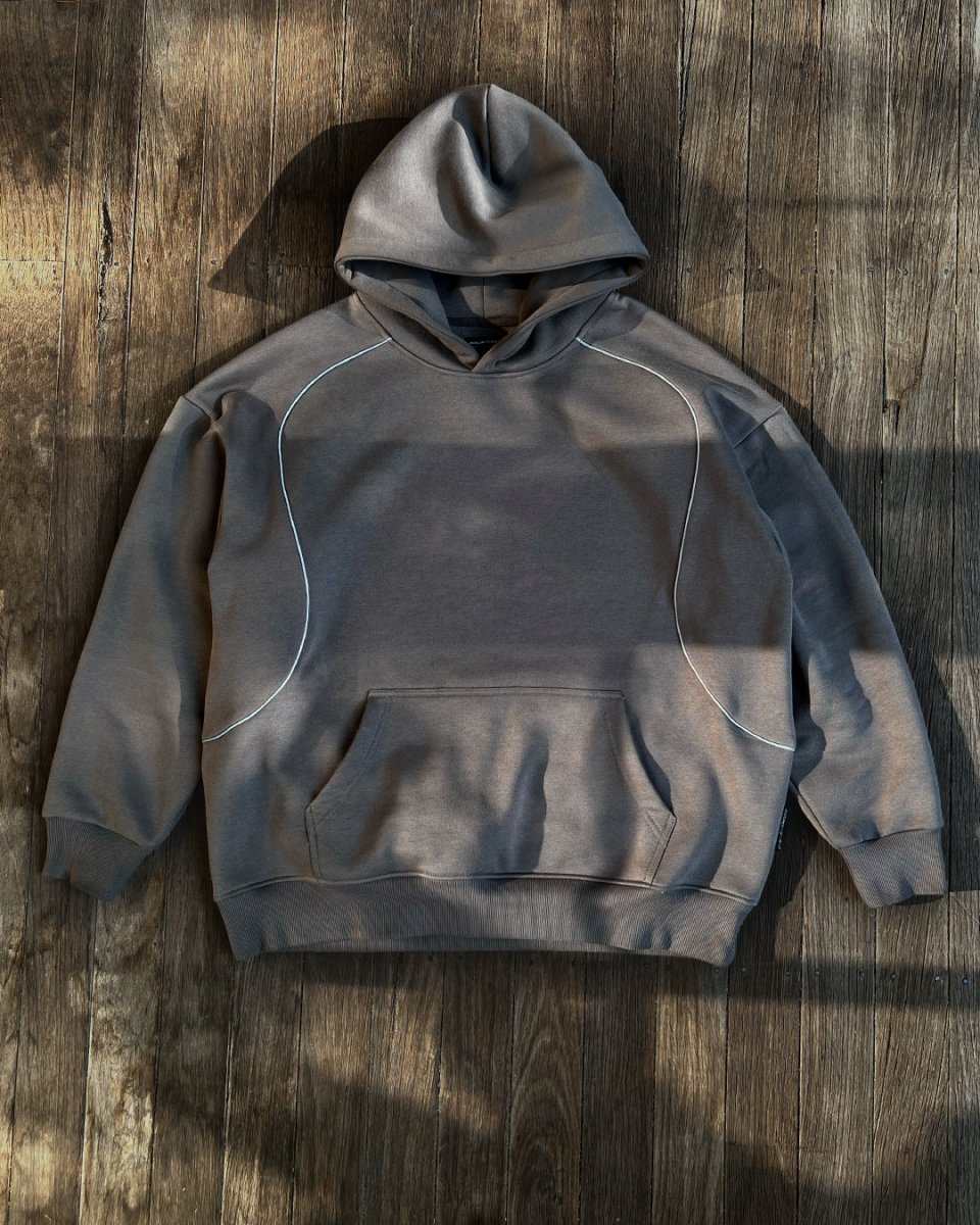 Charcoal oversized hoodie with reflective accent lines, front flat lay