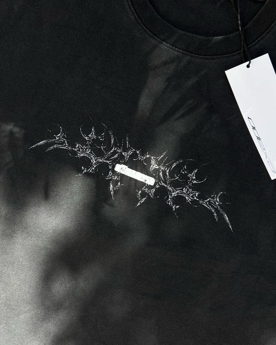 Close-up of white bone chest print on black vintage tee