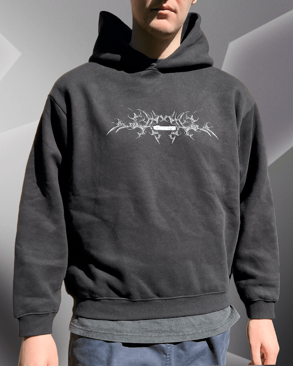 Model wearing black White Bone boxy hoodie, front view