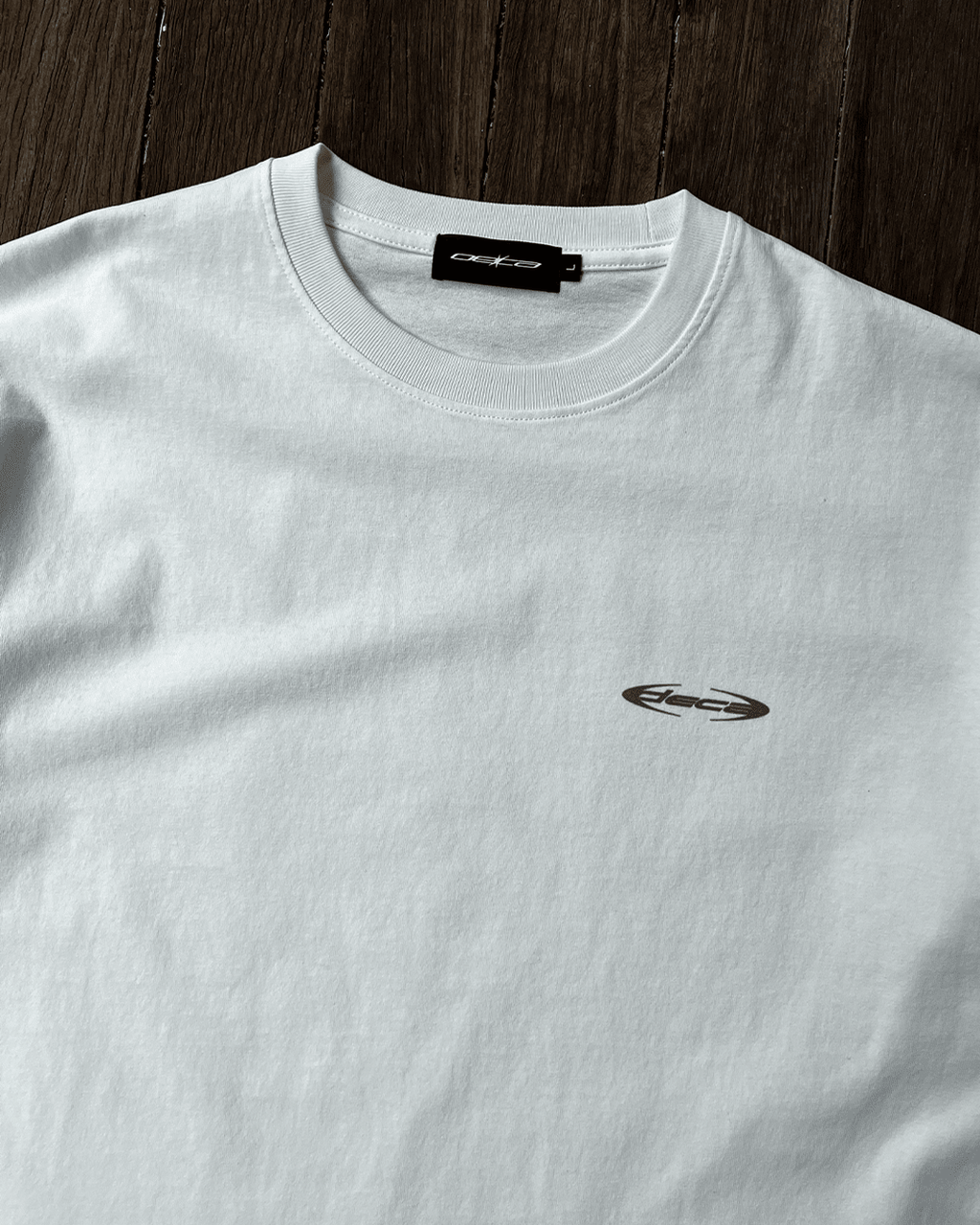 White Blue Wave vintage tee with small chest logo, front flat lay