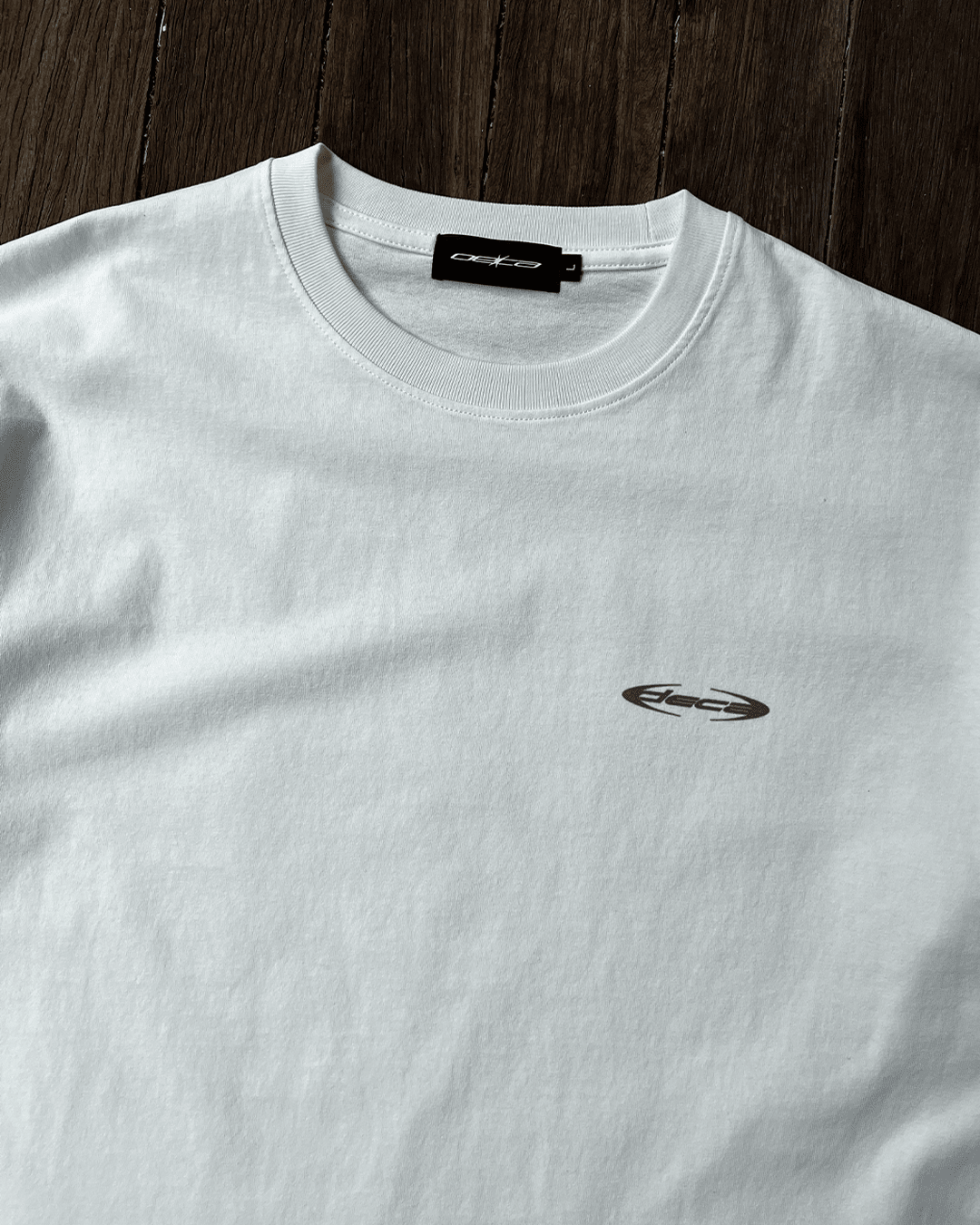 White Blue Wave vintage tee with small chest logo, front flat lay