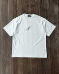 White vintage tee with black chrome star print, flat lay