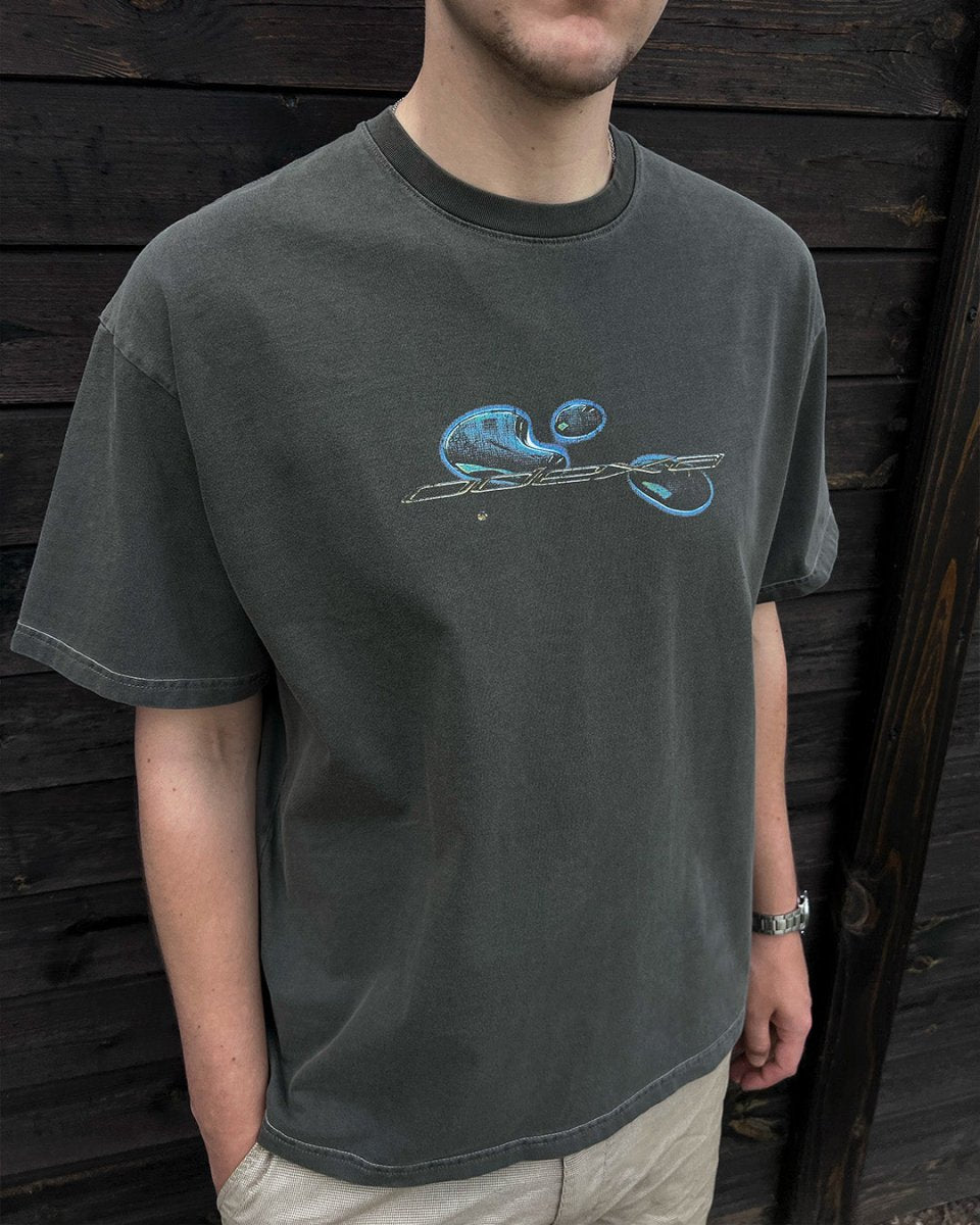 Model wearing washed grey Comic Logo vintage tee