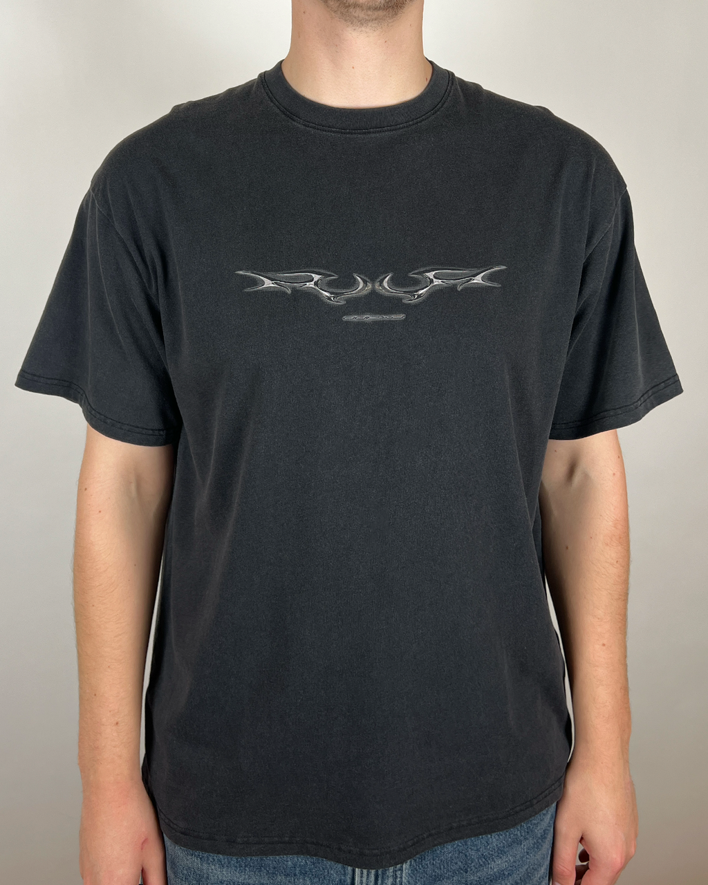 Model wearing washed black Digital Chrome Sigil vintage tee