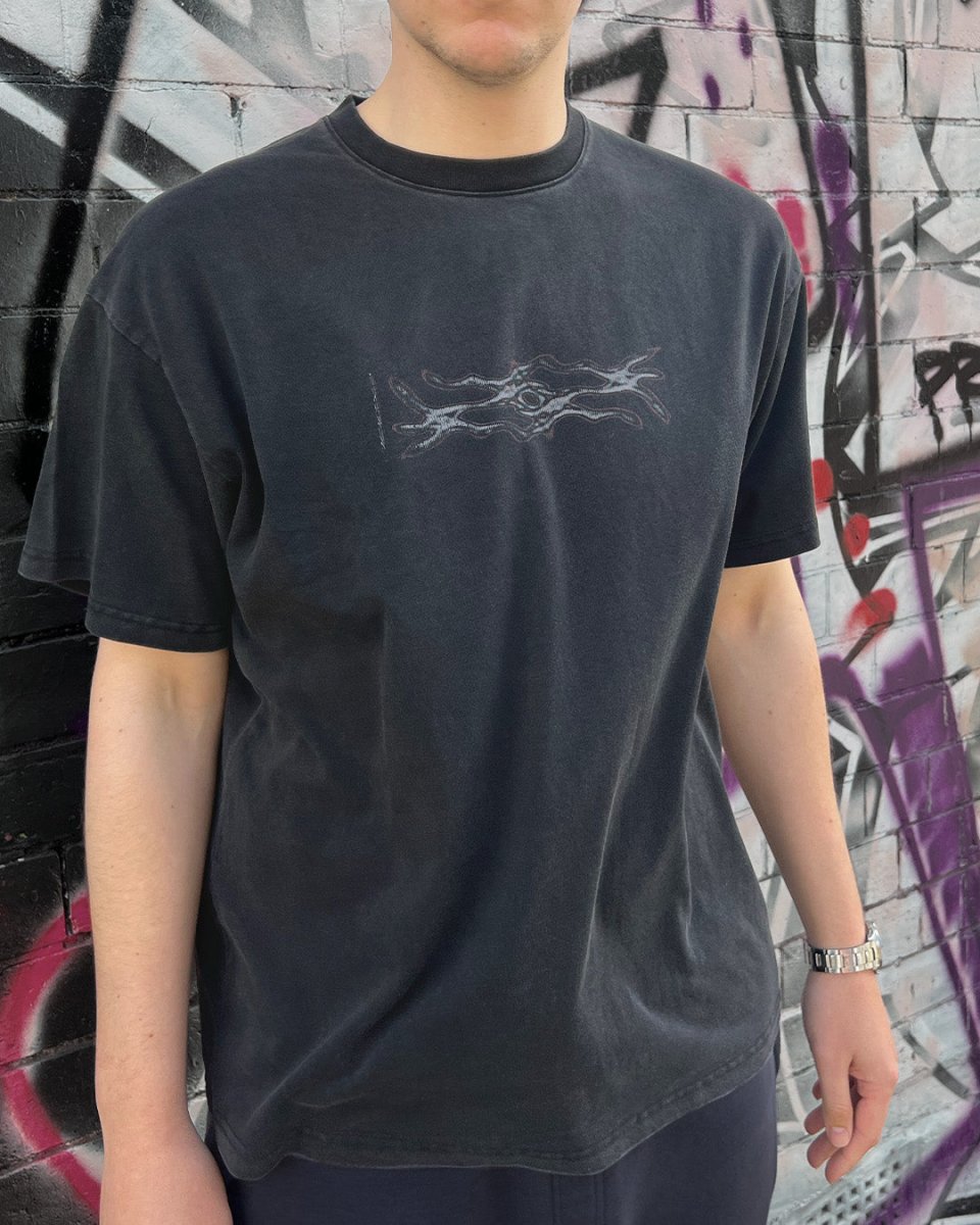 Model wearing washed black Digital Decay vintage tee
