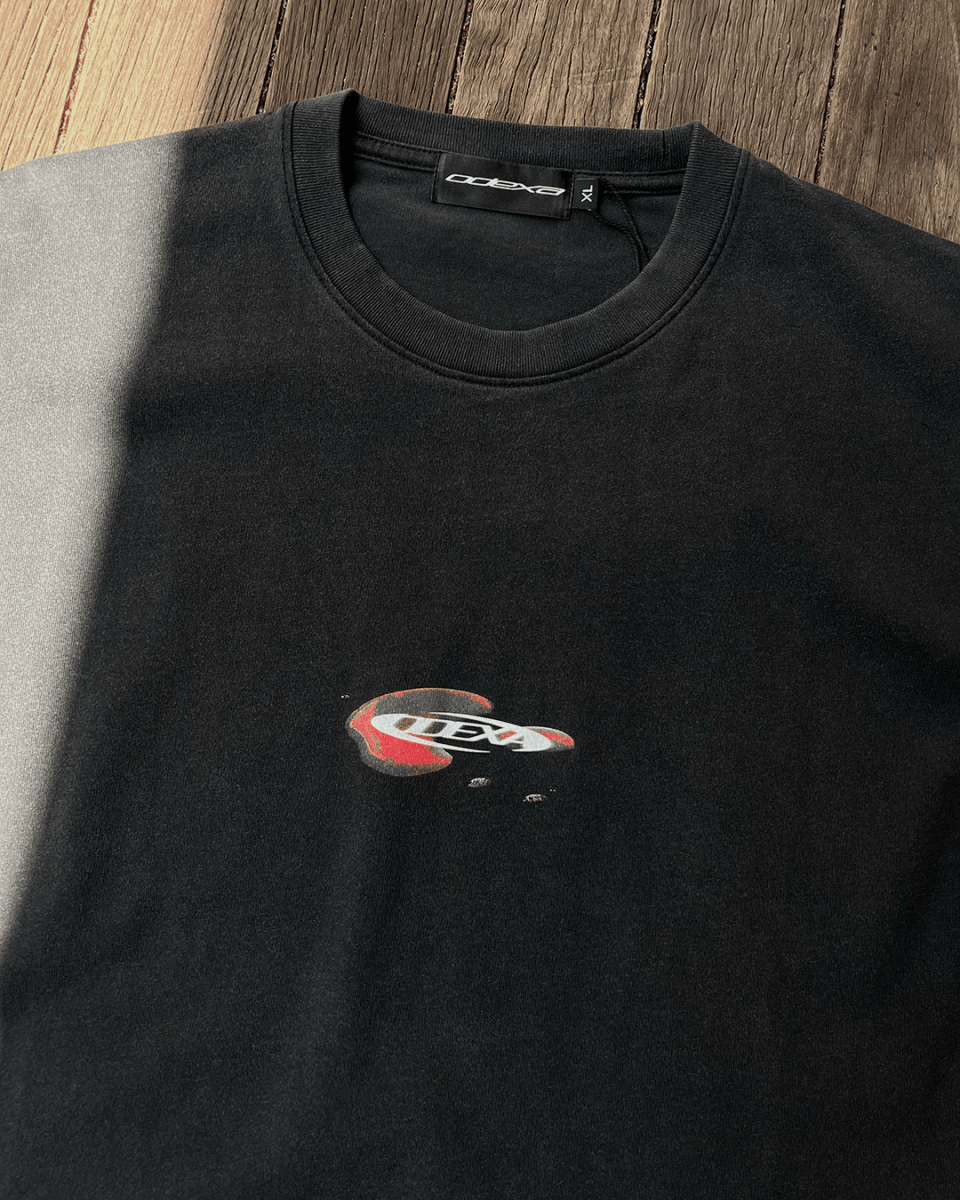 Droplet Text vintage tee with red droplet print, sunlit flat lay