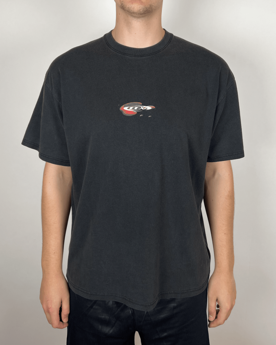 Model wearing washed black Droplet Text vintage tee