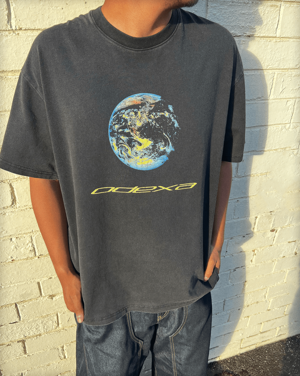 Model wearing washed black Earth 1 vintage tee