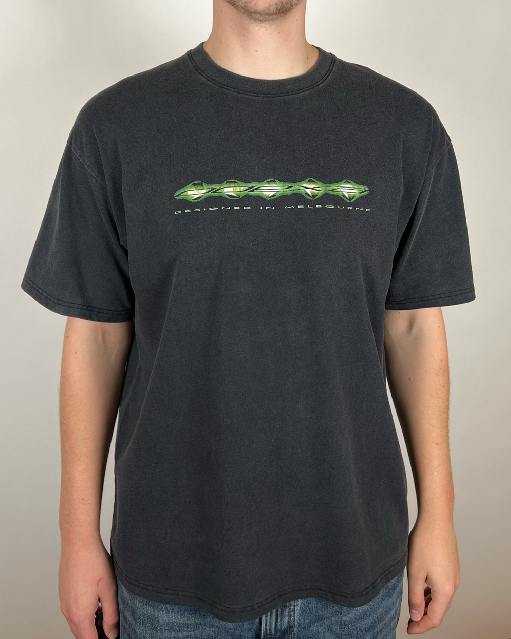 Model wearing washed black Green Digital Logo vintage tee