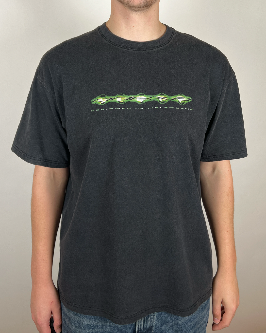 Model wearing washed black Green Digital Logo vintage tee