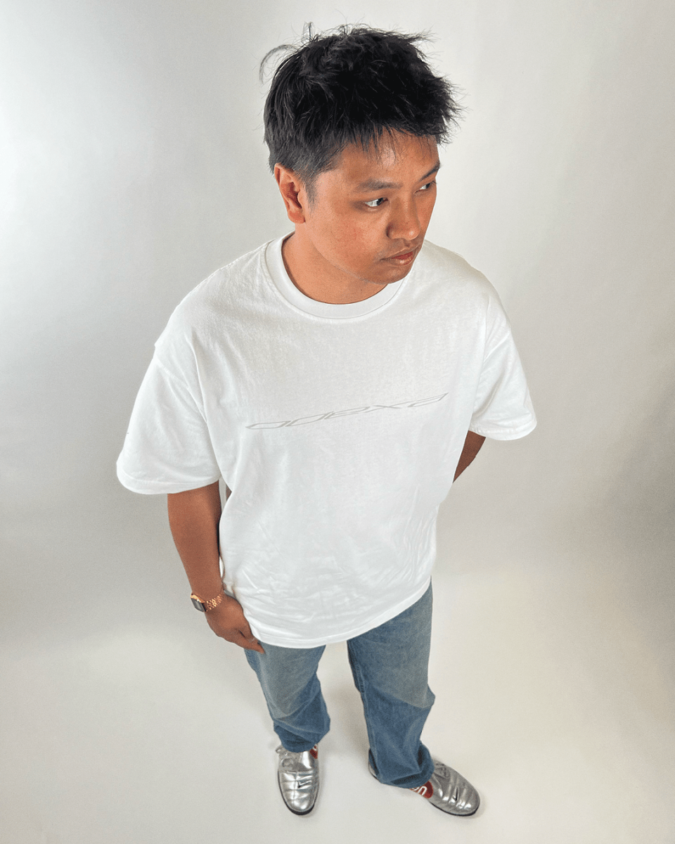 Model wearing white Grey Logo vintage tee, full length