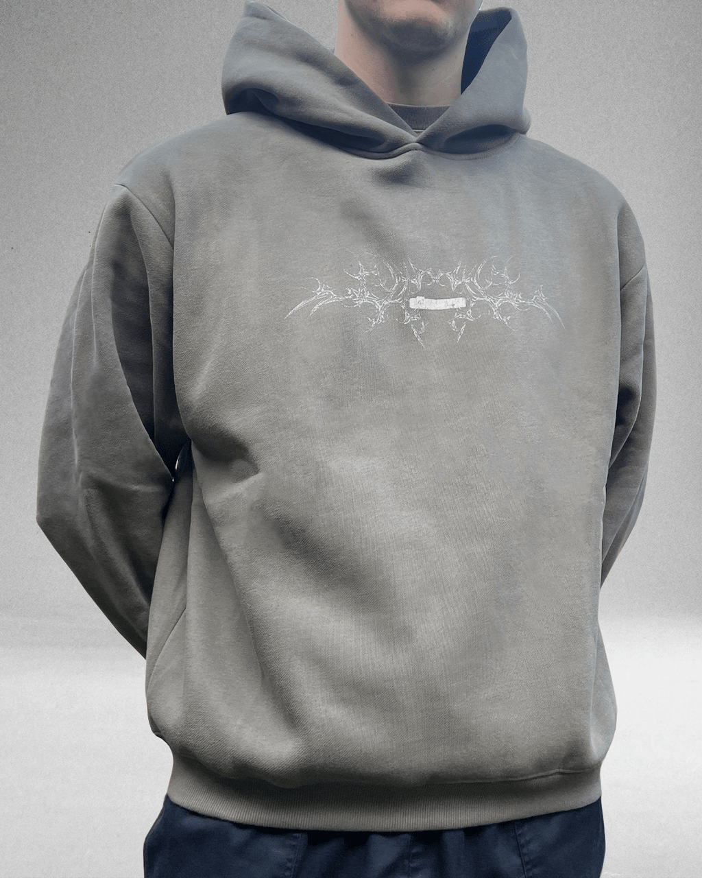 Model wearing moss grey White Bone hoodie, front view