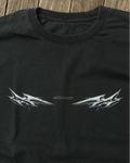 Black vintage tee with chrome lightning tribal print, flat lay
