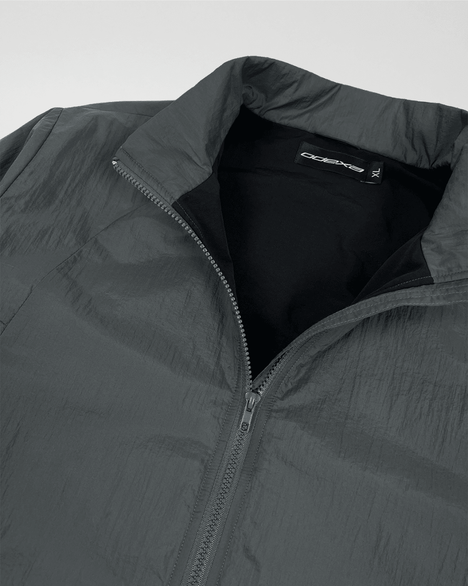 Close-up of slate green windbreaker collar and black lining