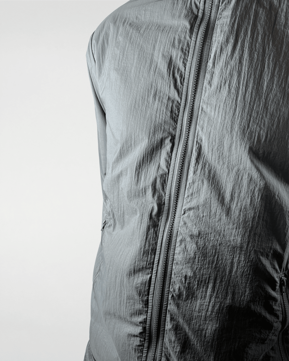 Close-up of slate green windbreaker front zip