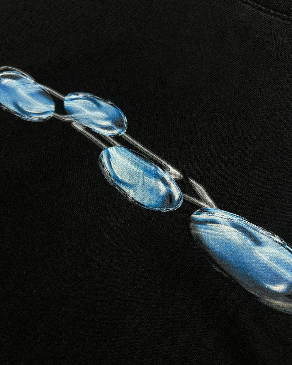 Close-up of blue liquid chrome logo print