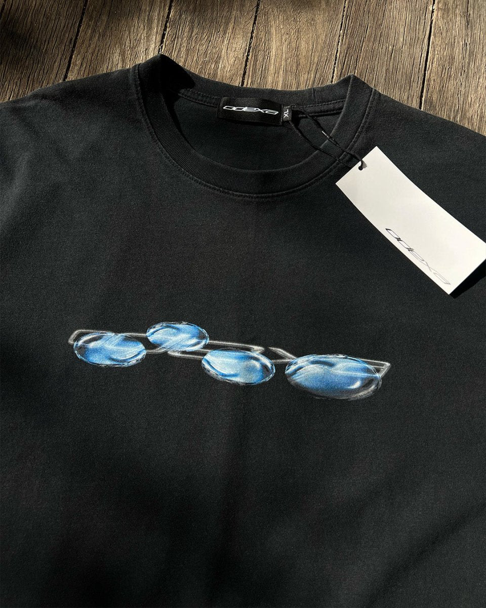 Black vintage tee with blue liquid chrome logo print, flat lay