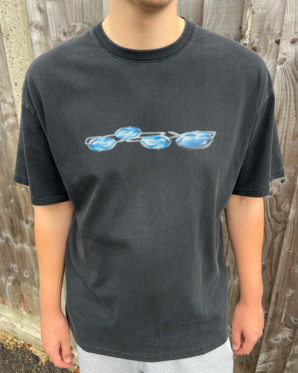 Model wearing washed black Liquid Logo vintage tee