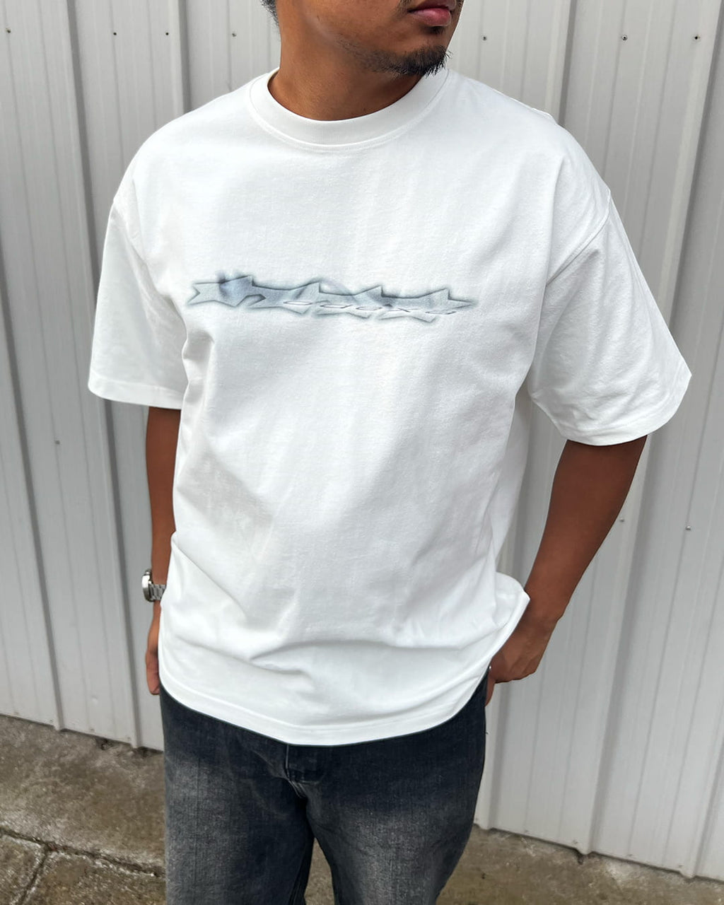 Model wearing white Logo Stars vintage tee