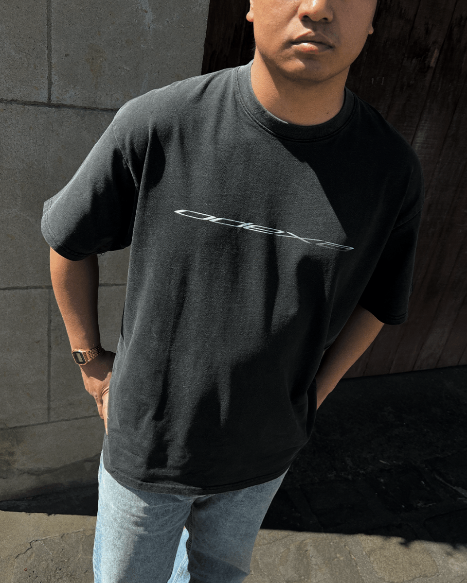 Model wearing washed black Metallic Logo vintage tee