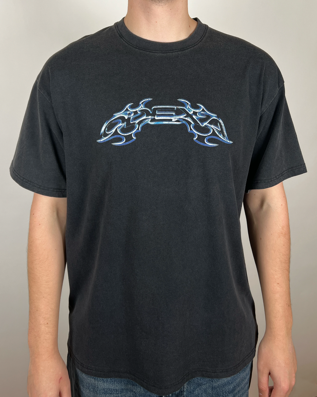 Model wearing washed black Neon Text vintage tee