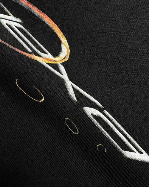 Close-up of orange chrome ring ODEXA logo print