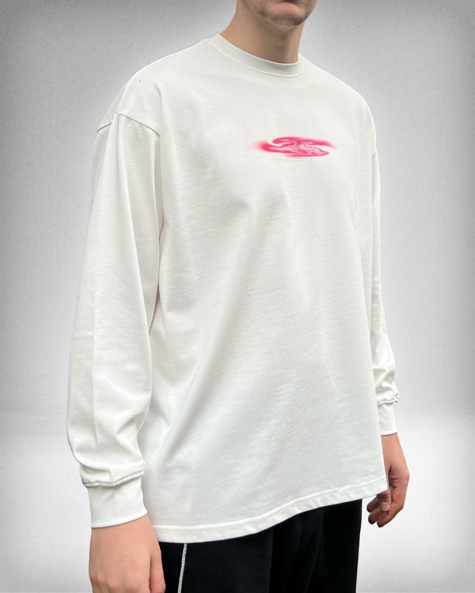 Model wearing white Pink Blob oversized long sleeve tee