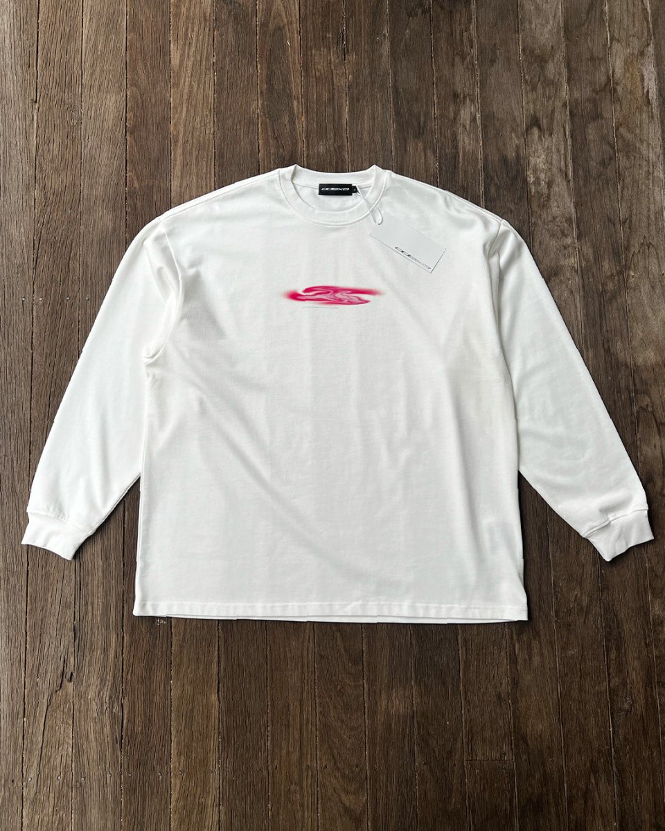 White oversized long sleeve tee with pink blob chest print, flat lay