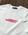 Close-up of pink blob print on white long sleeve tee