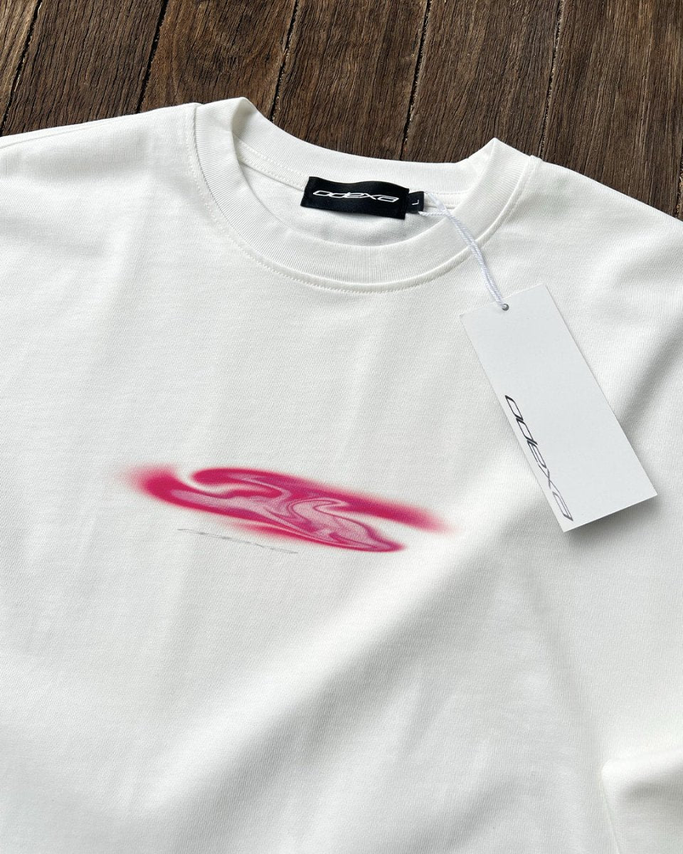 Close-up of pink blob print on white long sleeve tee