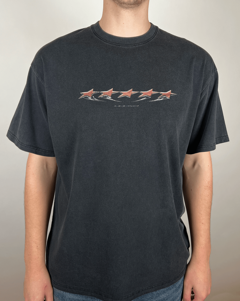 Model wearing washed black Red Stars vintage tee