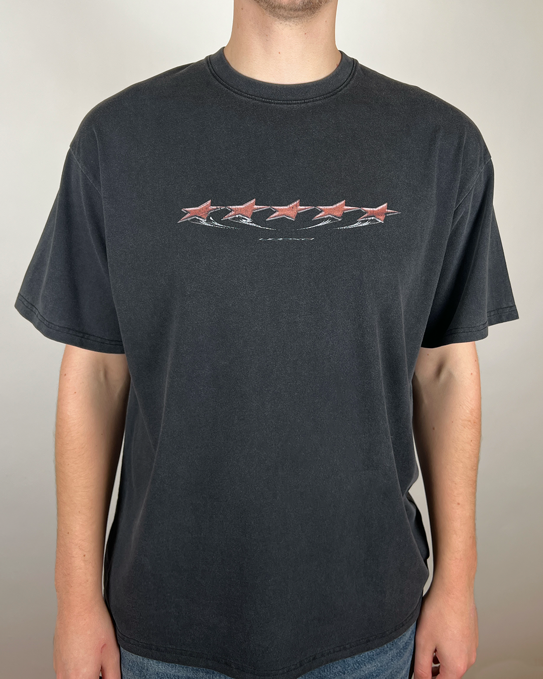 Model wearing washed black Red Stars vintage tee