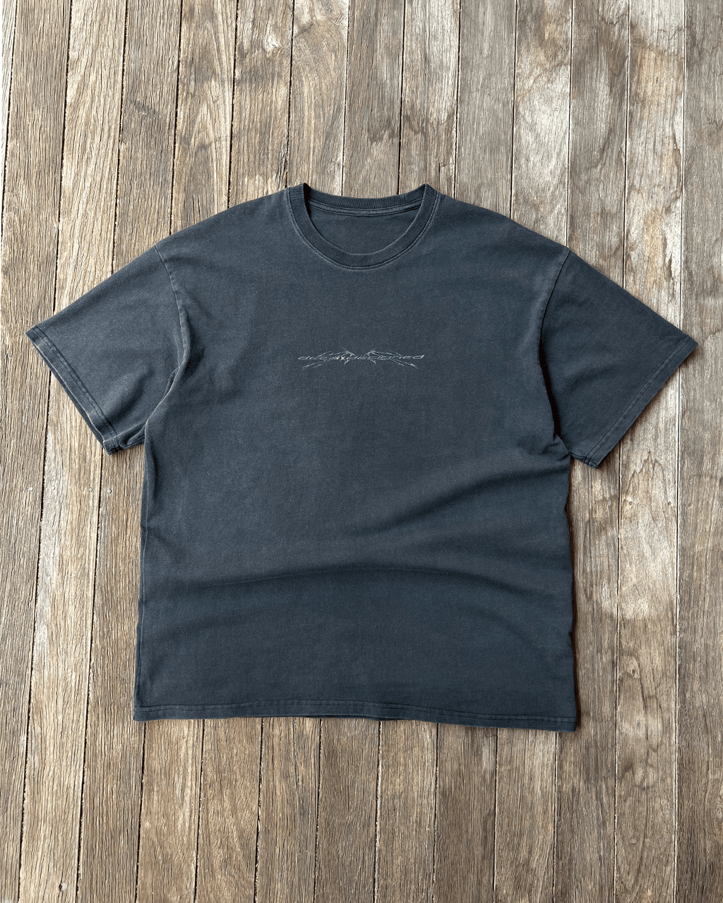 Washed black Sharp Black vintage tee with small chest print, front flat lay