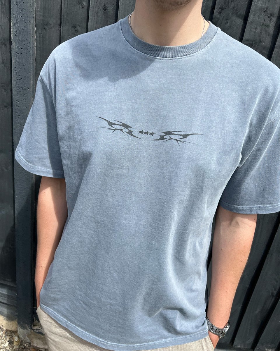 Model wearing washed blue Star Sigil vintage tee