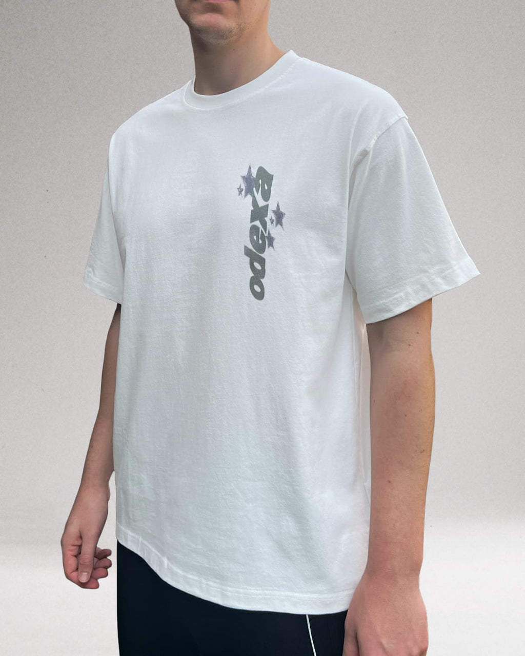 Model wearing white Vertical Logo vintage tee