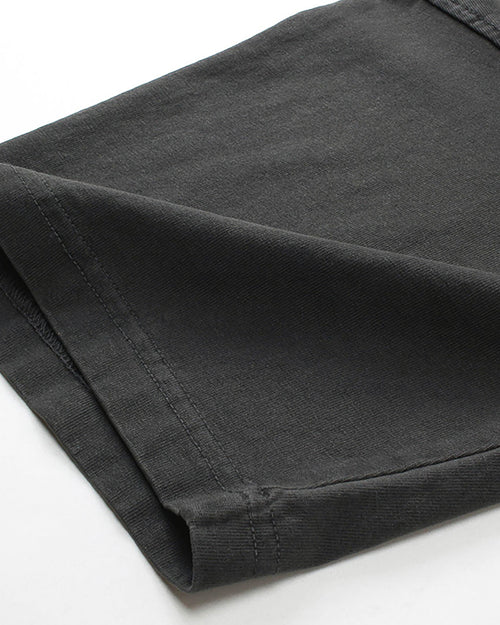 Close-up of folded sleeve cuff on washed black vintage tee showing fabric texture
