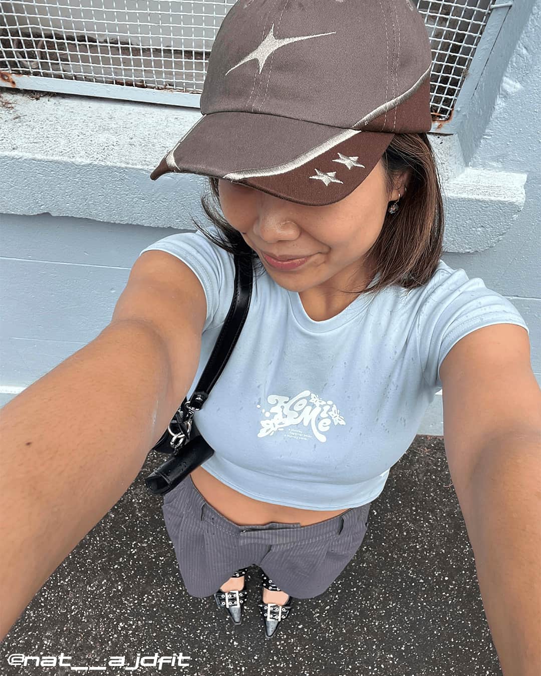Woman wearing brown Wheat Gold Star contrast cap with star details