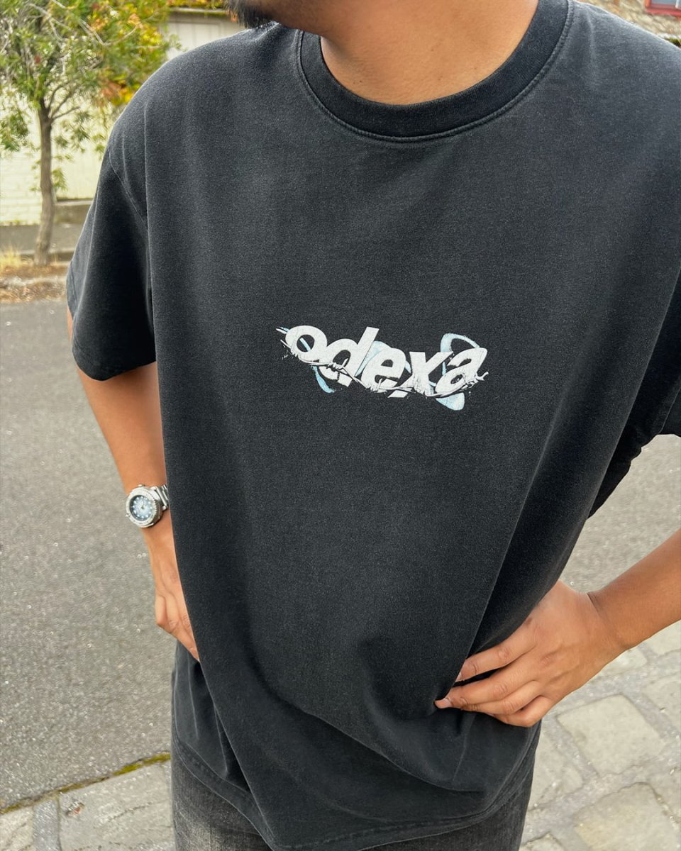 Model wearing washed black Wire Logo vintage tee