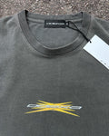 Washed black vintage tee with yellow spark ODEXA logo, flat lay
