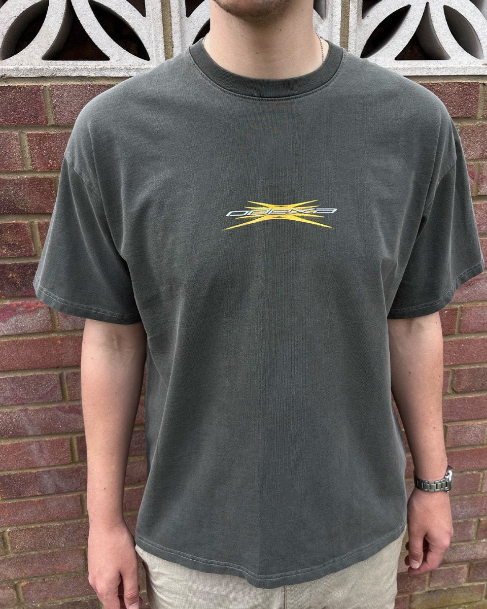 Model wearing washed black Yellow Spark vintage tee